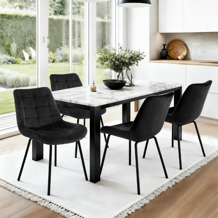 Set of 4 Carlton grid-tufted dining chairs in midnight black velvet with matching matte black legs in a modern monochrome dining room.