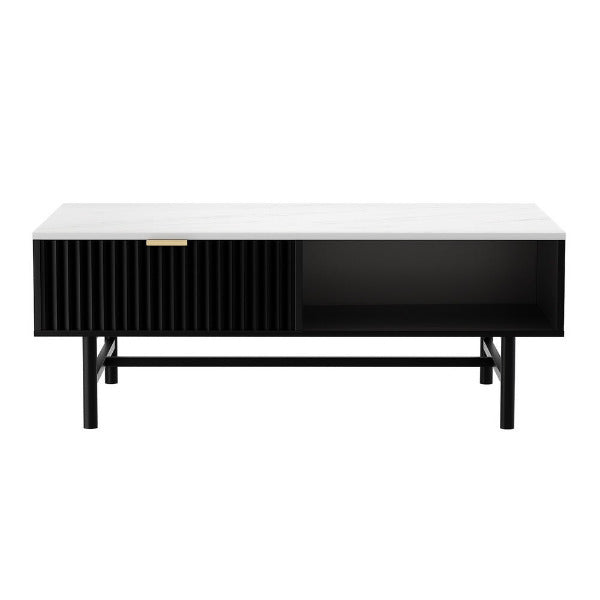 Detail view of the Ezra coffee table showing the fluted drawer with brushed gold handle and the spacious open storage shelf.