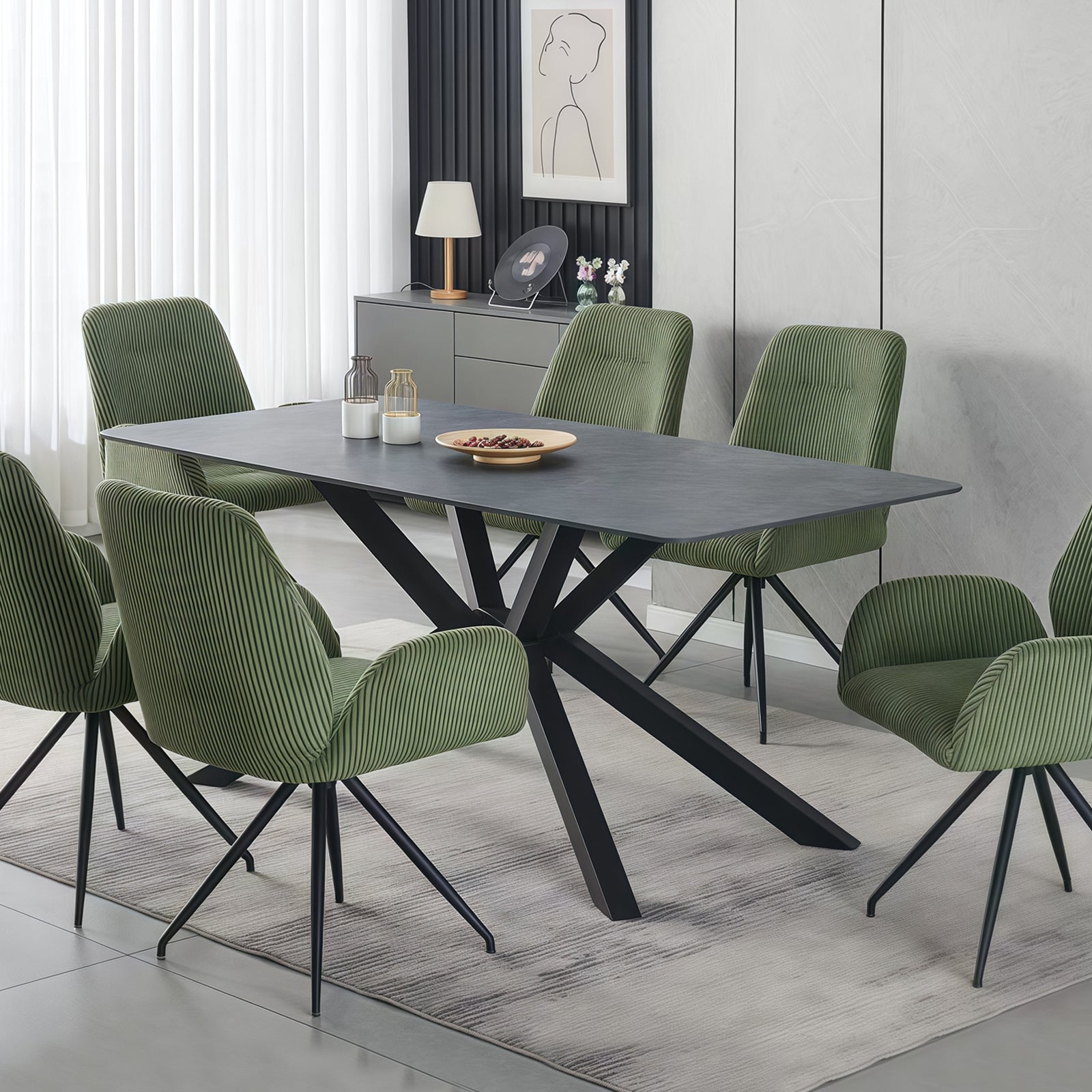 The Juniper 180cm dining table featuring a deep emerald sintered stone top and matte black steel legs in a luxury Melbourne dining room.
