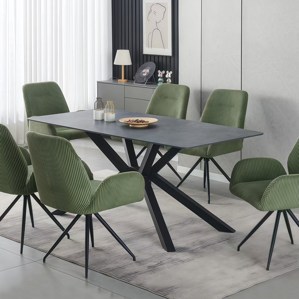 The Juniper 180cm dining table featuring a deep emerald sintered stone top and matte black steel legs in a luxury Melbourne dining room.