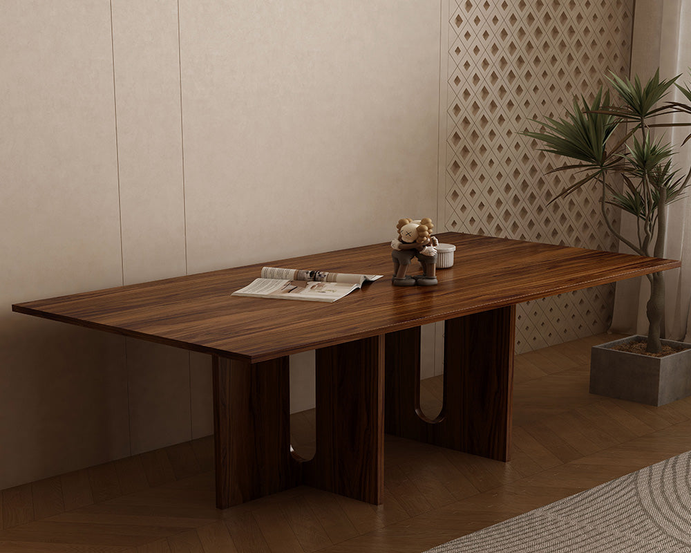 The Kensington 200cm grand dining table in rich walnut finish, seating 8 persons in a sophisticated modern interior.
