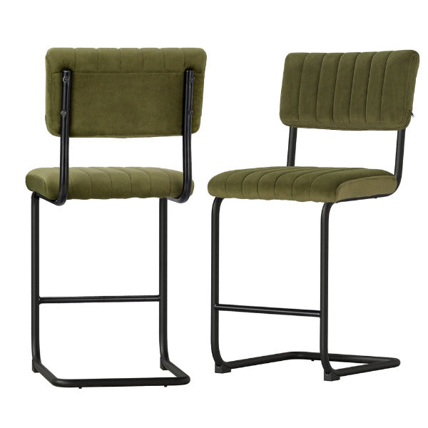 Detailed view of the vertical channel tufting and premium olive green velvet upholstery on the Orman stool.