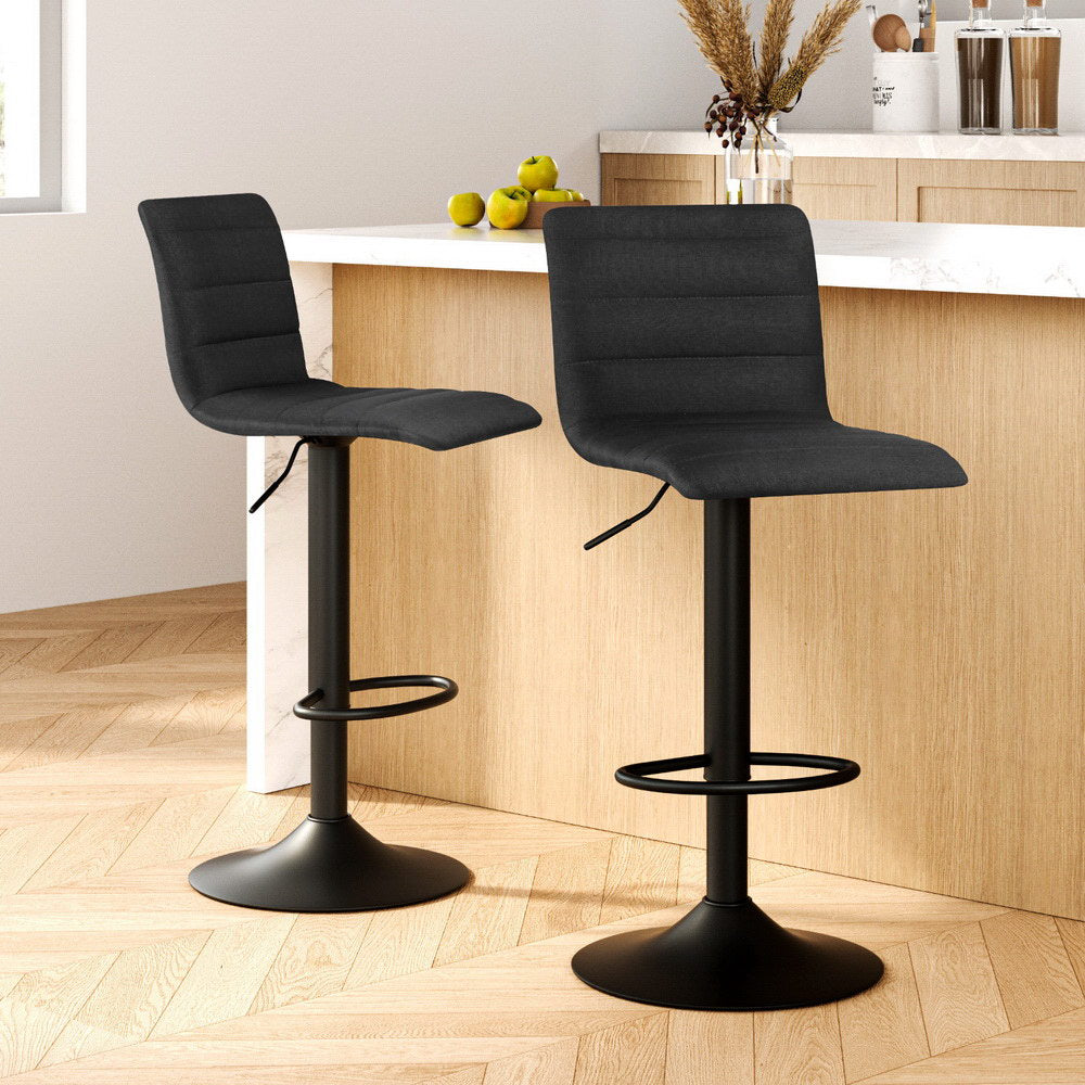 Set of 2 The Lennox black linen swivel bar stools with matte black base styled in a modern Australian kitchen island.