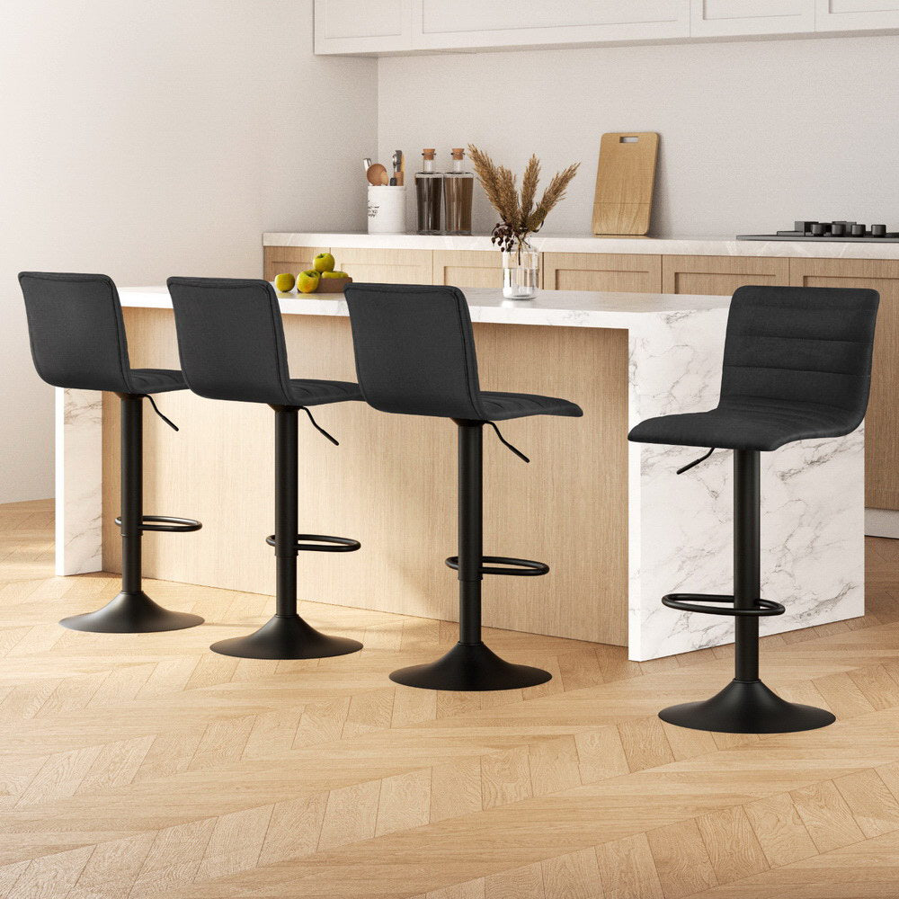 Set of 4 The Lennox black linen swivel bar stools with matte black base styled in a modern Australian kitchen island.